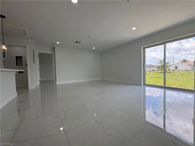 Unfurnished room with recessed lighting and light marble finish floors