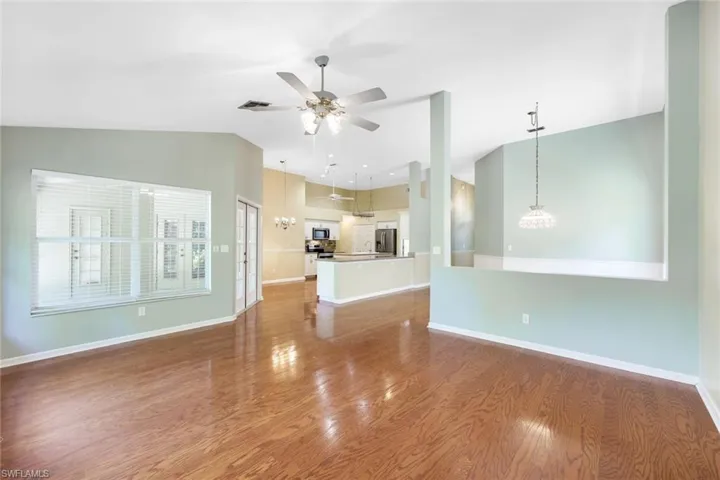 View from family room back toward kitchen. Dining room on other side of half wall.