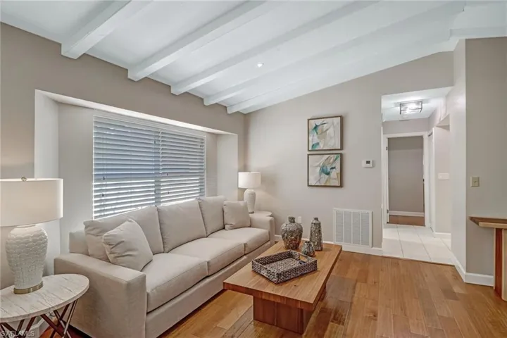 Living room with light wood finished floors and baseboards