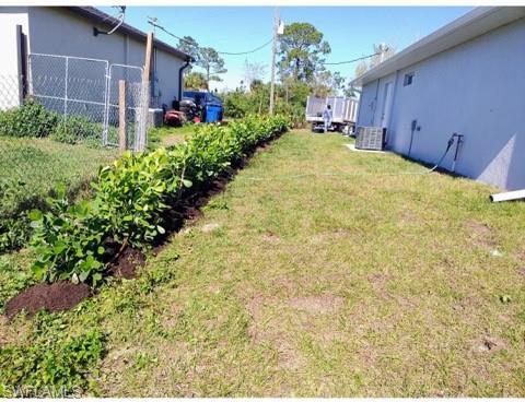 new privacy hedge planted on right side of home