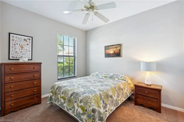 Bedroom featuring ceiling fan and carpet flooring