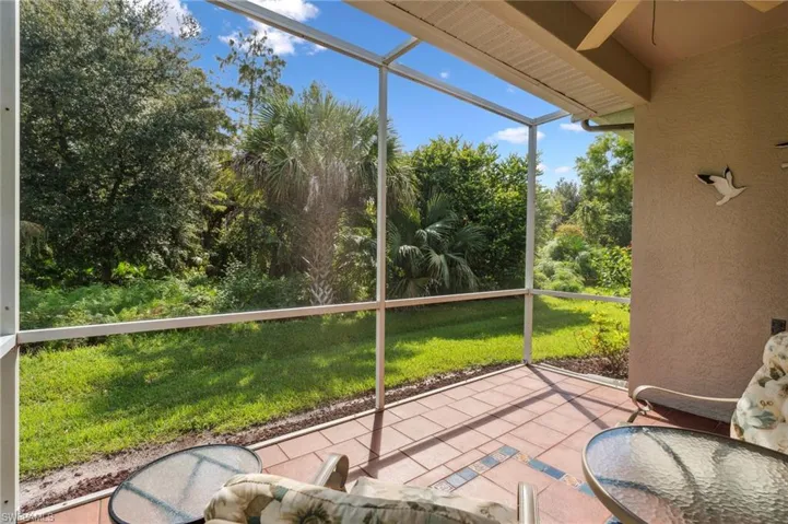 Unfurnished sunroom featuring ceiling fan