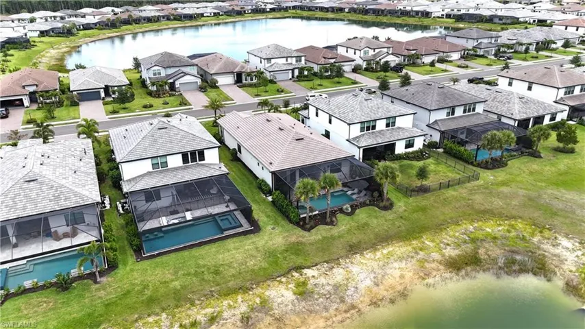 Two-story residence with a screened lanai and an integrated swimming pool and spa