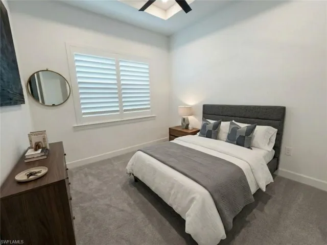 *Virtually Staged*Recessed window featuring white louvered shutters and trim