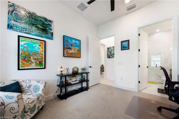 Carpeted room with high ceilings, recessed lighting, and a ceiling fan