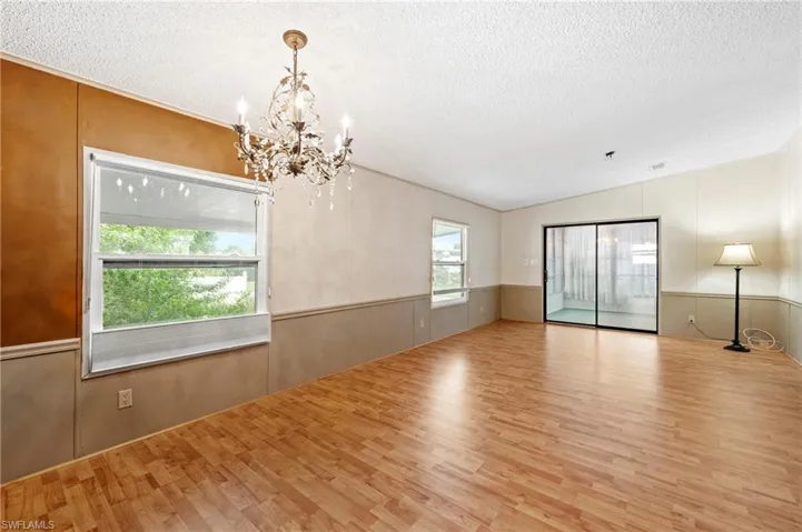 Family room from the kitchen with the dining area closest to you.