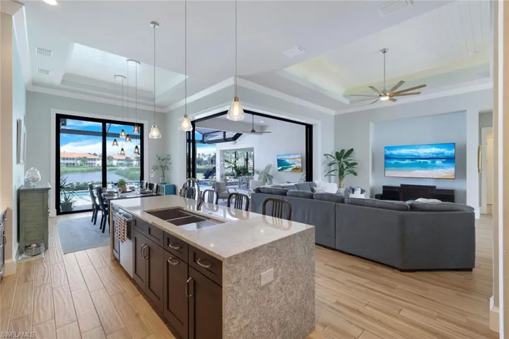 Kitchen featuring a raised ceiling and plenty of natural light
