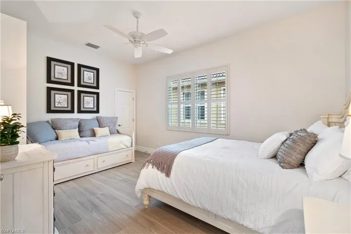 Bedroom featuring ceiling fan and light wood-type flooring
