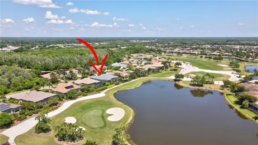 Aerial view with a water view, a residential view, and golf course view