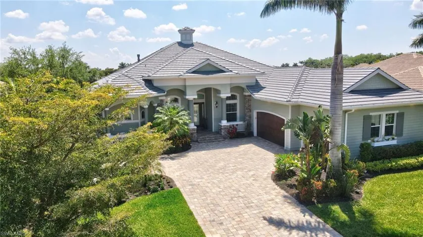View of front of home featuring a 3 garage, a new tiled roof, and decorative  ample driveway