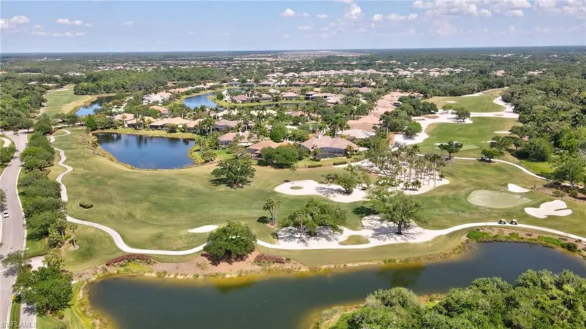 Bird's eye view of golf course, abundance of lakes throughout