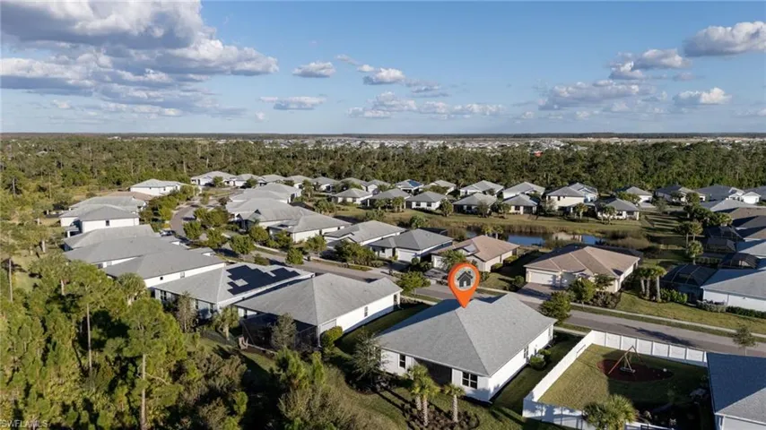 Experience the breathtaking aerial view of Lake Babcock Neighborhood, showcasing not just the stunning homes, but also the enchanting preserve nestled behind them. This perspective reveals the natural beauty that complements this vibrant community.