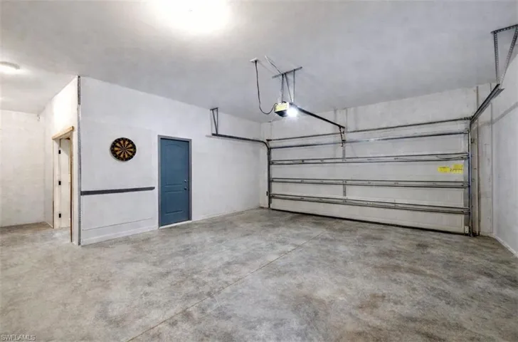 Three-car garage with air conditioning in the workshop area.