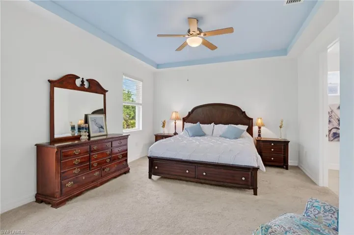 The oversized owner's ensuite features a ceiling fan and a bathroom attached for convenience.