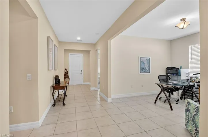 Hallway leading toward the front door with a flex room to the right, which could be set up as a formal dining room space.
