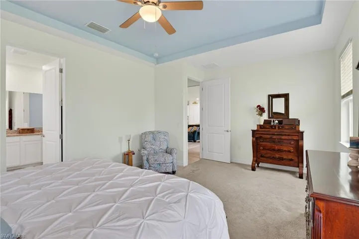 The oversized owner's ensuite features a ceiling fan and a bathroom attached for convenience.