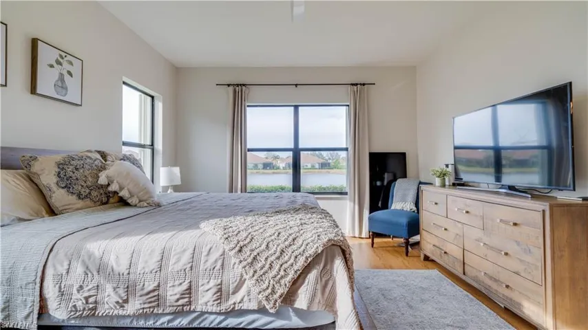 Bedroom with light wood-style floors and ceiling fan