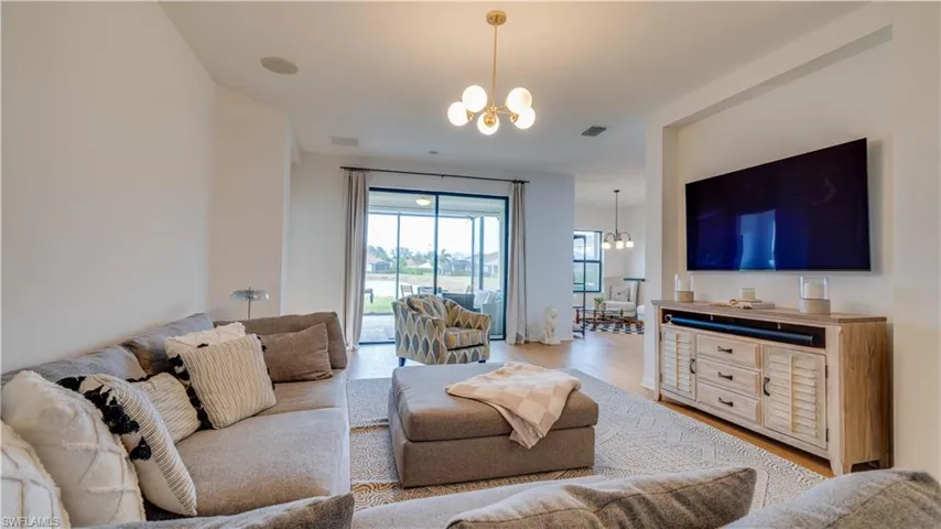Living room with a chandelier and wood finished floors