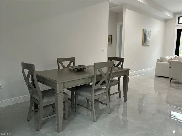 Dining room with tile patterned floors