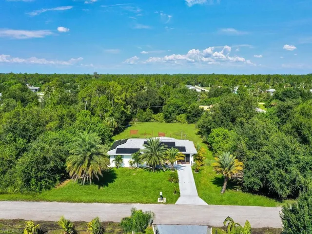 Aerial view featuring a view of trees