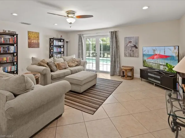 Tile flooring, recessed lighting, and a ceiling fan with integrated light fixture