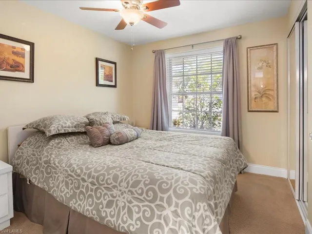 Room with neutral-toned walls and carpeted flooring
