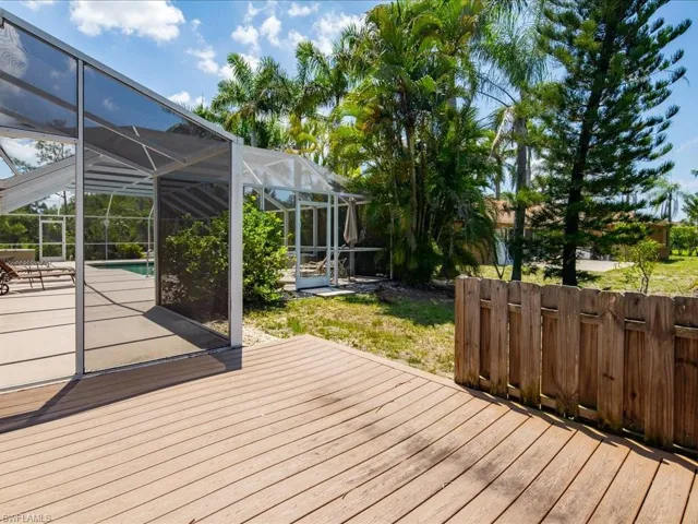 Expansive wood-finish decking with a privacy fence