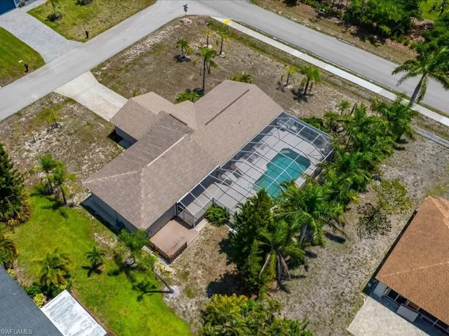 Single-story residential structure featuring a hip roof and an enclosed swimming pool