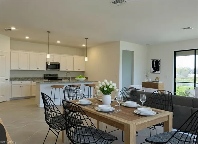 Dining space featuring recessed lighting