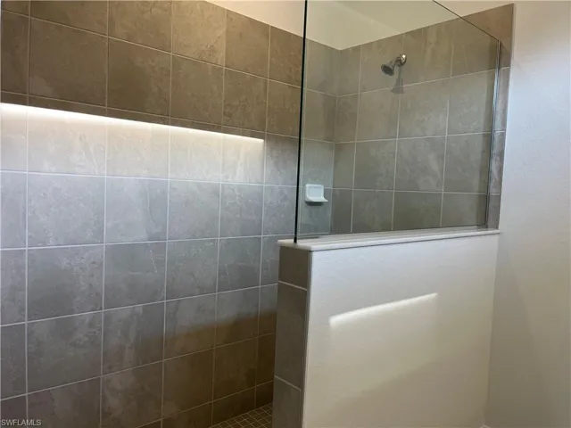 Bathroom featuring a walk in shower