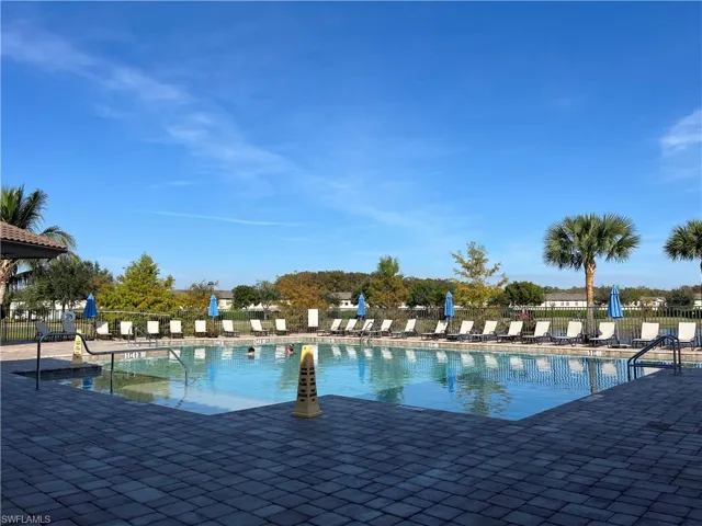 Community pool with a patio area