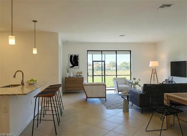 Living room featuring light tile patterned floors