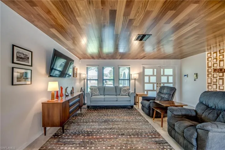 Living room with french doors and wooden ceiling