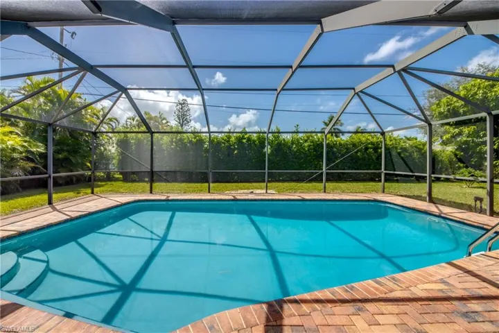 View of pool featuring a lanai