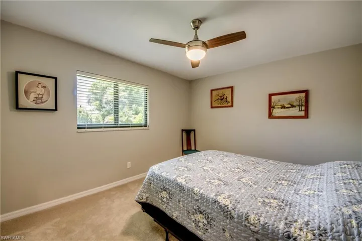Bedroom with carpet flooring and ceiling fan