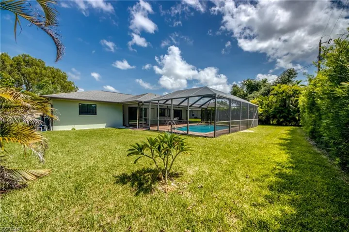 View of yard with a lanai and a patio area