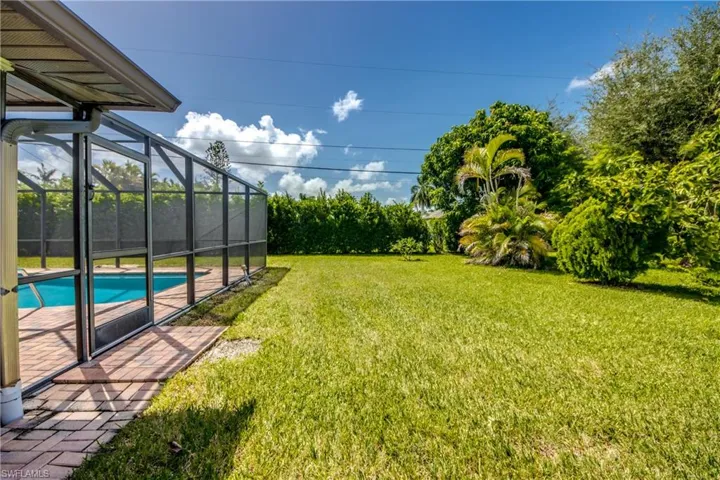 View of yard featuring a lanai