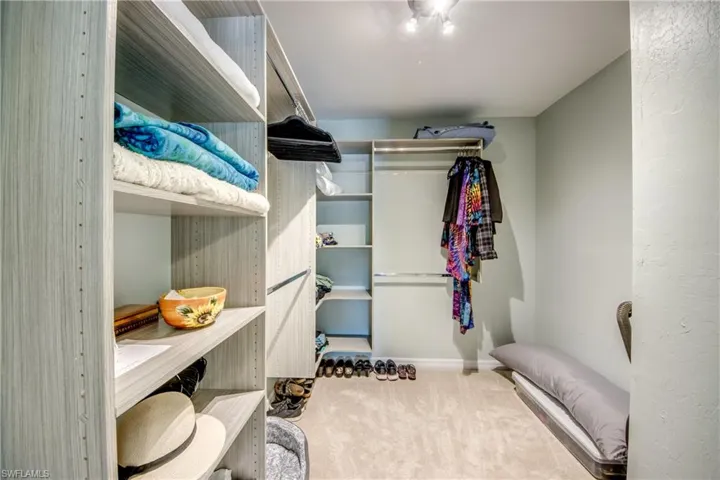 Walk in closet featuring carpet