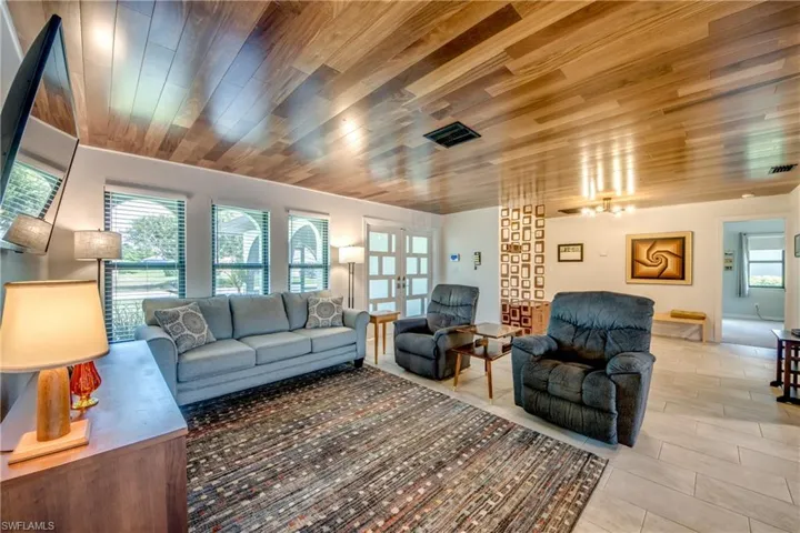 Living room featuring wooden ceiling