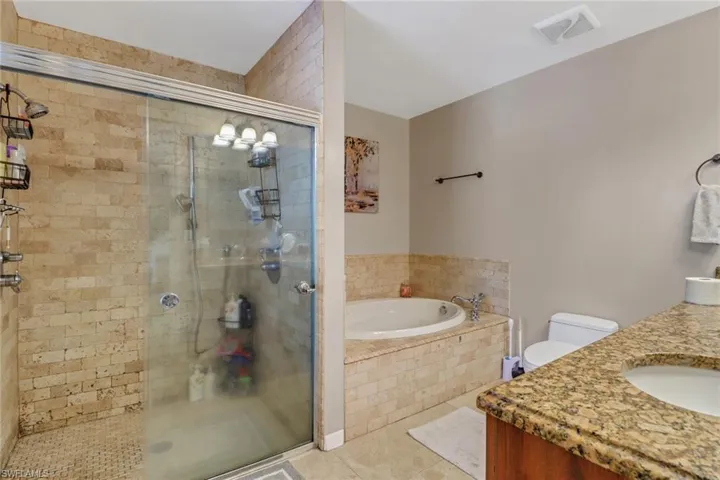 Master Bath with large soaking tub, separate shower, and large vanity area with ample counter space to get ready