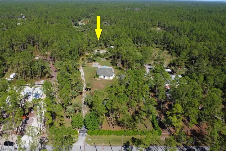 Beautiful 2.73-acre lot that is 100% upland and private! Long paved driveway that leads you to the 2 car garae with an additional driveway that leads you to the back of the lot that is fully cleared with canopy and storage container in the exterior of the lot. Calusa privacy shrubs and fencing throughout the property!