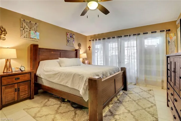 Spacious master bedroom with access to the lanai area and a large custom built master closet.