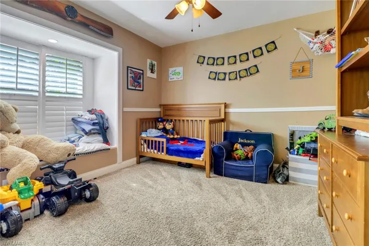 Large bedroom #2 with custom built window nook and new plantation shutters. Carpet is in great condition!