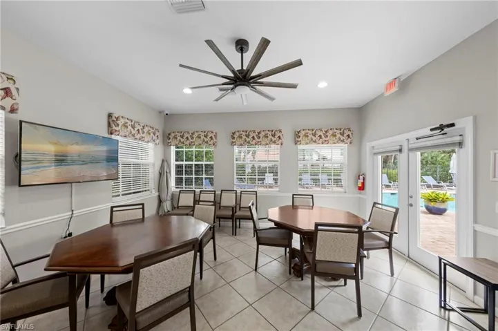 Tiled flooring, multiple windows with blinds, recessed lighting, and a ceiling fan