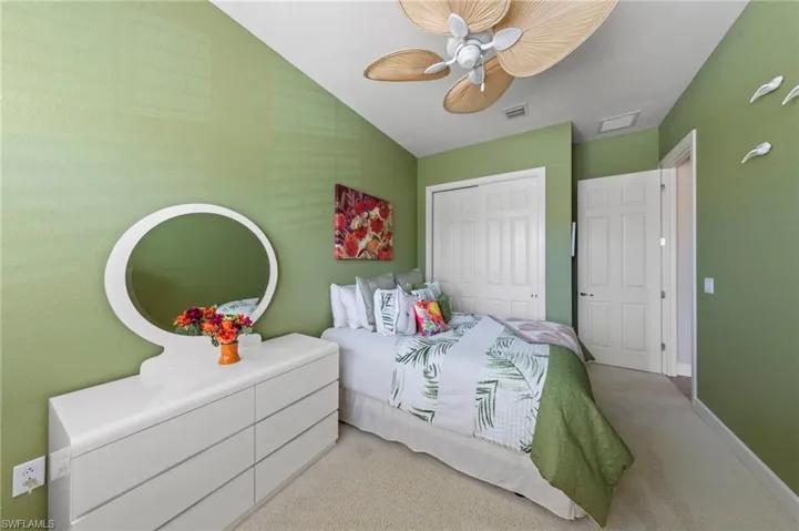Recessed lighting and a ceiling fan with natural-finish blades