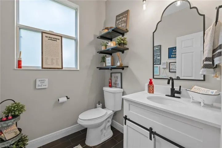 Half bath featuring vanity and wood tiled floors