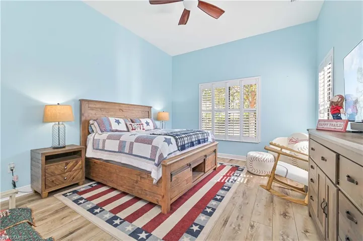 Bedroom featuring light wood-type flooring and ceiling fan