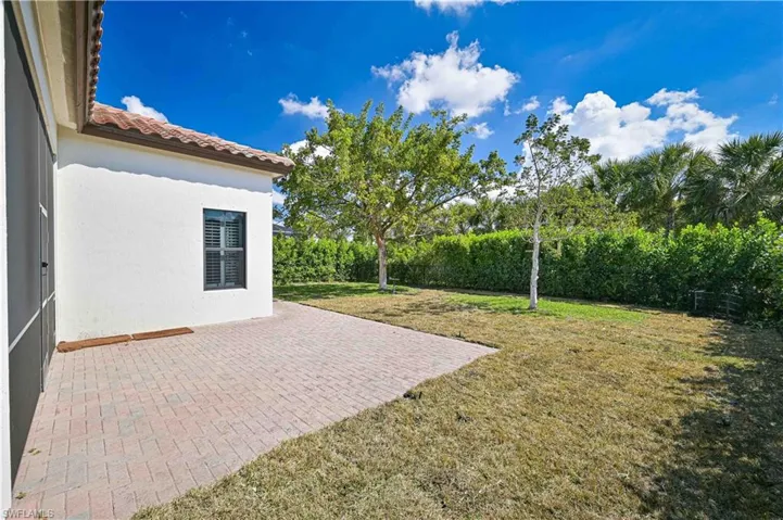 Fenced backyard with a patio area