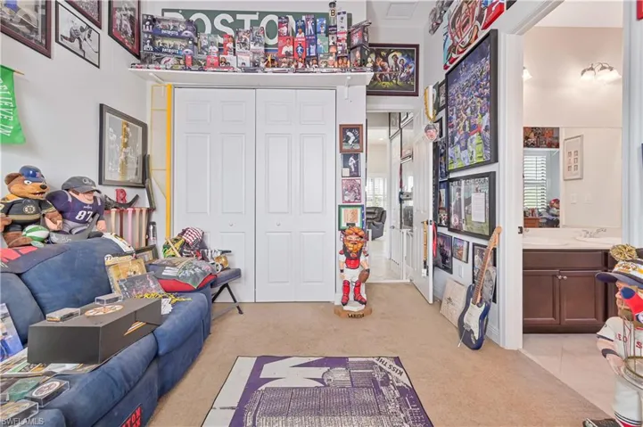 Playroom with light carpet and a high ceiling