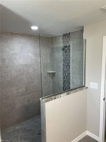 Bathroom with a tile shower